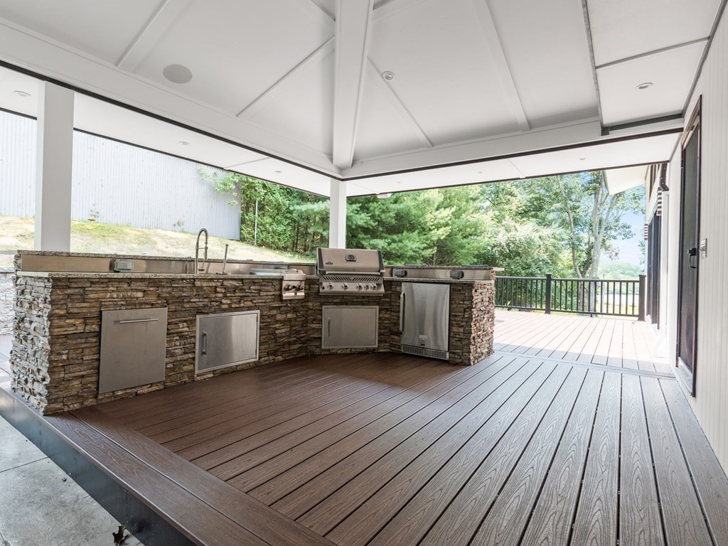 49 Reed Street Rehoboth, MA 02769 - Photo 33 of 40 a kitchen with stainless steel appliances granite countertop a stove a sink and a wooden floors