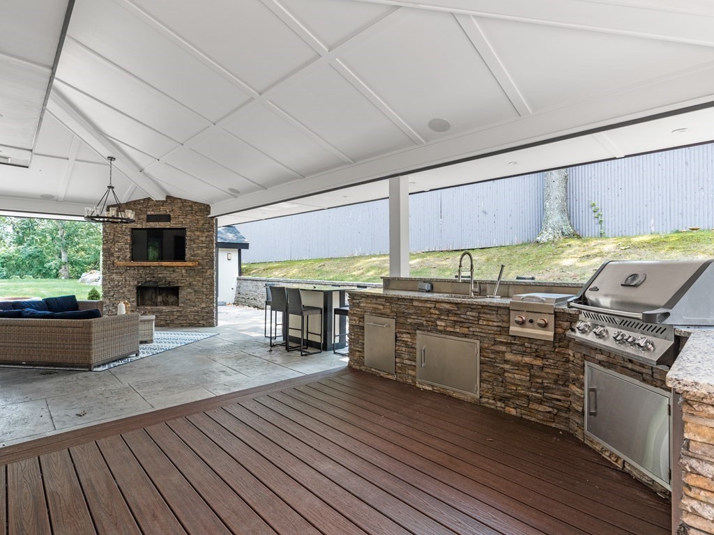 49 Reed Street Rehoboth, MA 02769 - Photo 34 of 40 a kitchen with stainless steel appliances granite countertop a stove and a wooden floors