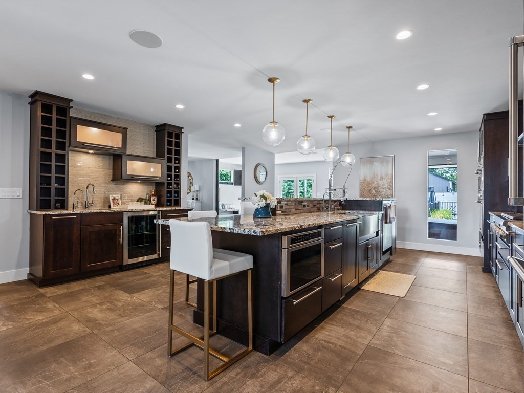 49 Reed Street Rehoboth, MA 02769 - Photo 7 of 40 a kitchen with stainless steel appliances granite countertop a stove and a sink