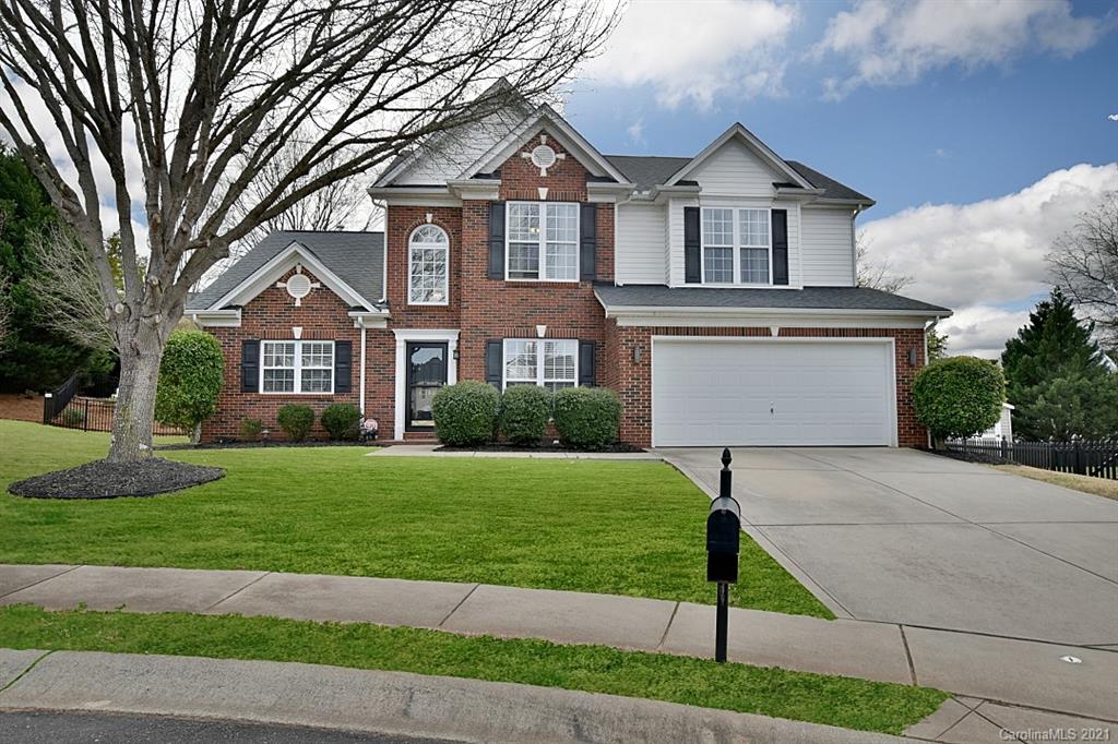6306 Hawks Eye Court Fort Mill, SC 29708 - Photo 1 of 26 a front view of a house with a yard and garage
