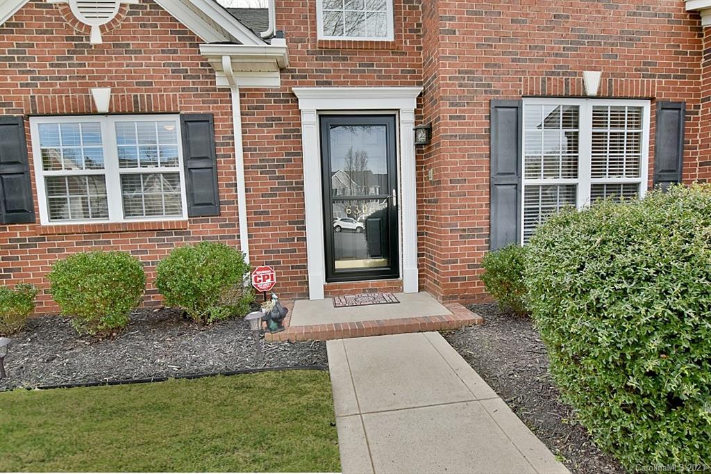 6306 Hawks Eye Court Fort Mill, SC 29708 - Photo 2 of 26 a front view of a brick house with a yard