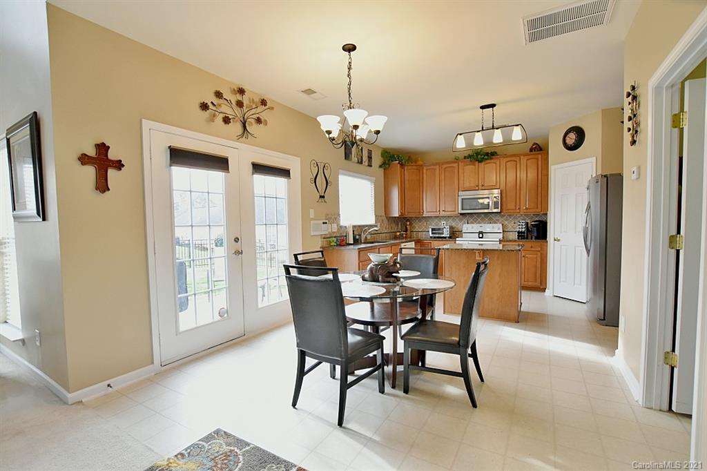 6306 Hawks Eye Court Fort Mill, SC 29708 - Photo 13 of 26 a view of a dining room with furniture and window