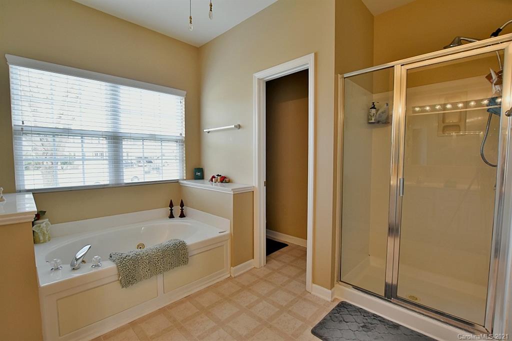 6306 Hawks Eye Court Fort Mill, SC 29708 - Photo 18 of 26 a bathroom with a tub shower and sink