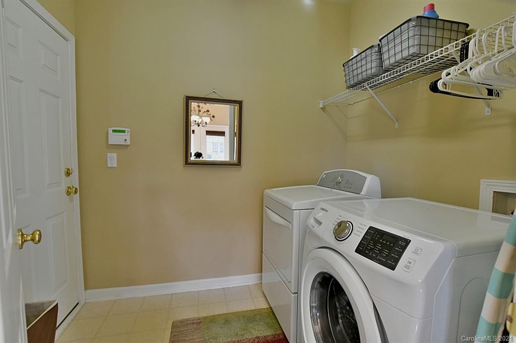 6306 Hawks Eye Court Fort Mill, SC 29708 - Photo 24 of 26 a utility room with dryer and washer