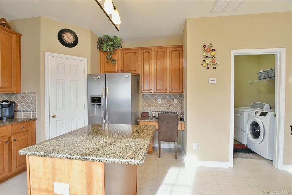 6306 Hawks Eye Court Fort Mill, SC 29708 - Photo 10 of 26 a bathroom with a granite countertop sink and a mirror