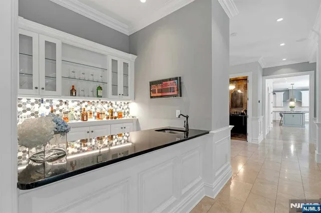 a view of a living room and kitchen