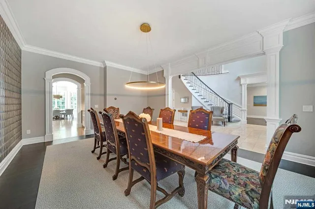 a living room with furniture a rug and white walls