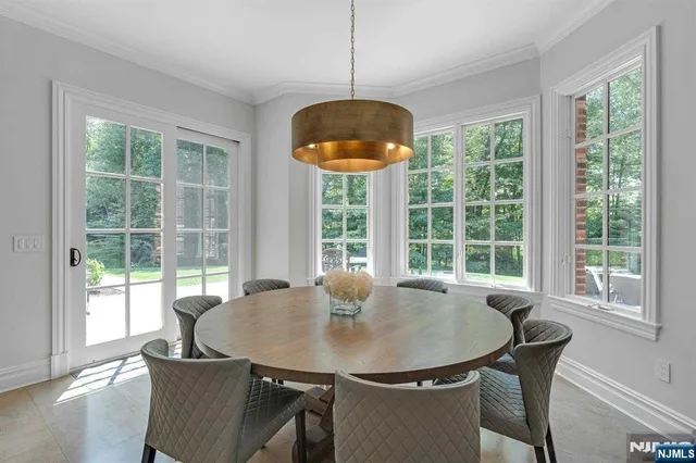 a view of a dining room with furniture and window