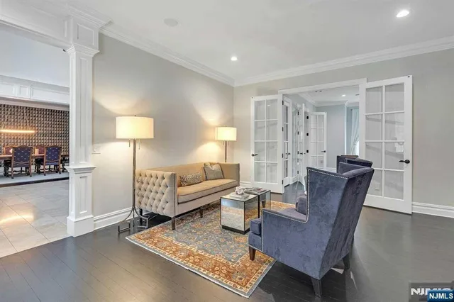 a living room with furniture a lamp and a table