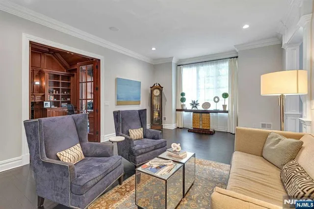 a living room with furniture and a lamp