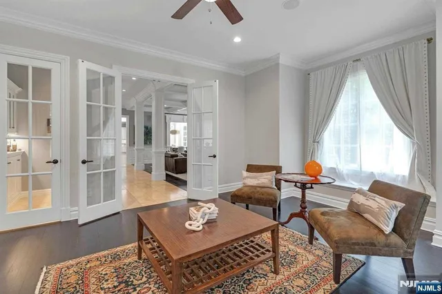 a living room with furniture and next to a window