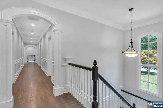 a spacious bedroom with a bed and a fireplace