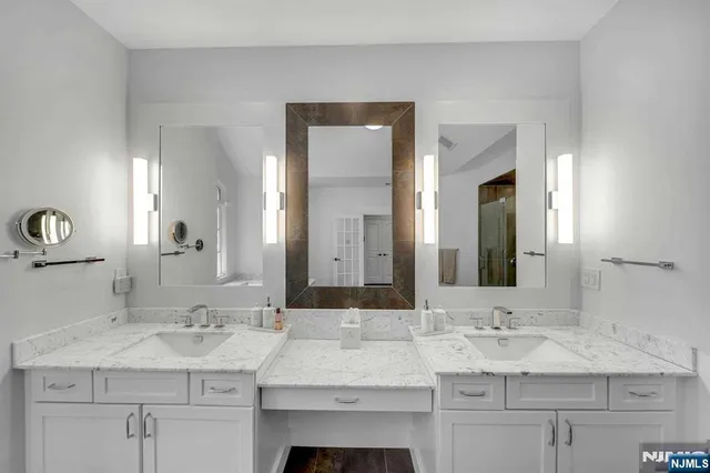 a view of a livingroom with wooden floor and staircase