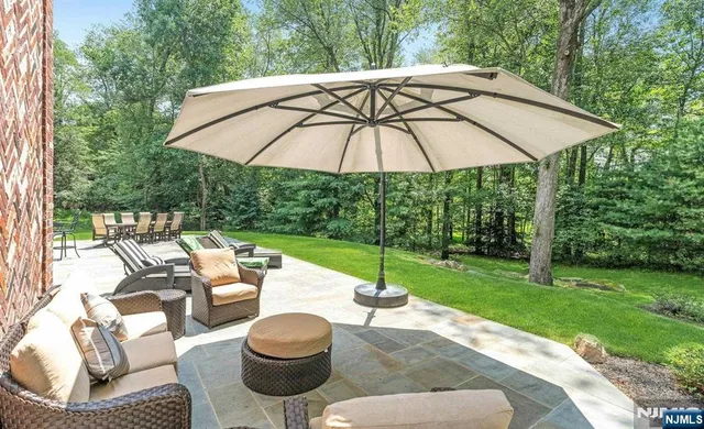 a patio with a patio table and chairs