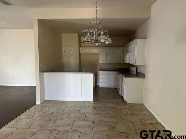 a view of a kitchen with a sink and dishwasher