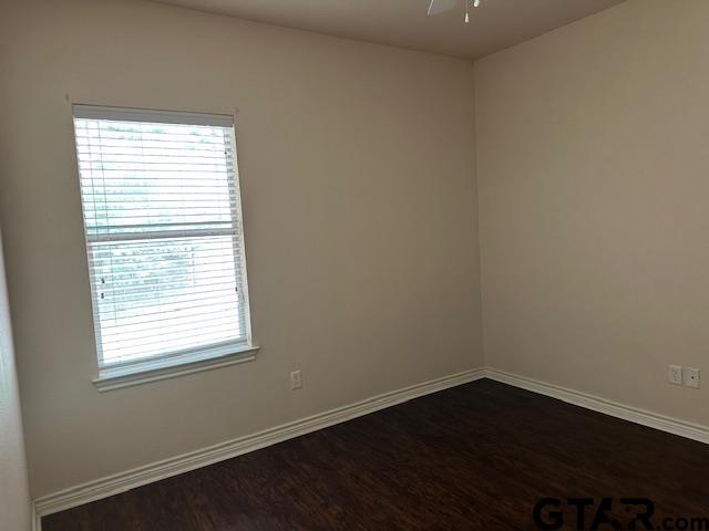 19602 FM 2493 Flint, TX 75762 - Photo 6 of 8 an empty room with wooden floor and a window