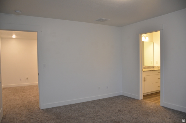 1842 South 1280th Street West Logan, UT 84321 - Photo 12 of 21 Neutral-toned carpet flooring with white baseboards and walls