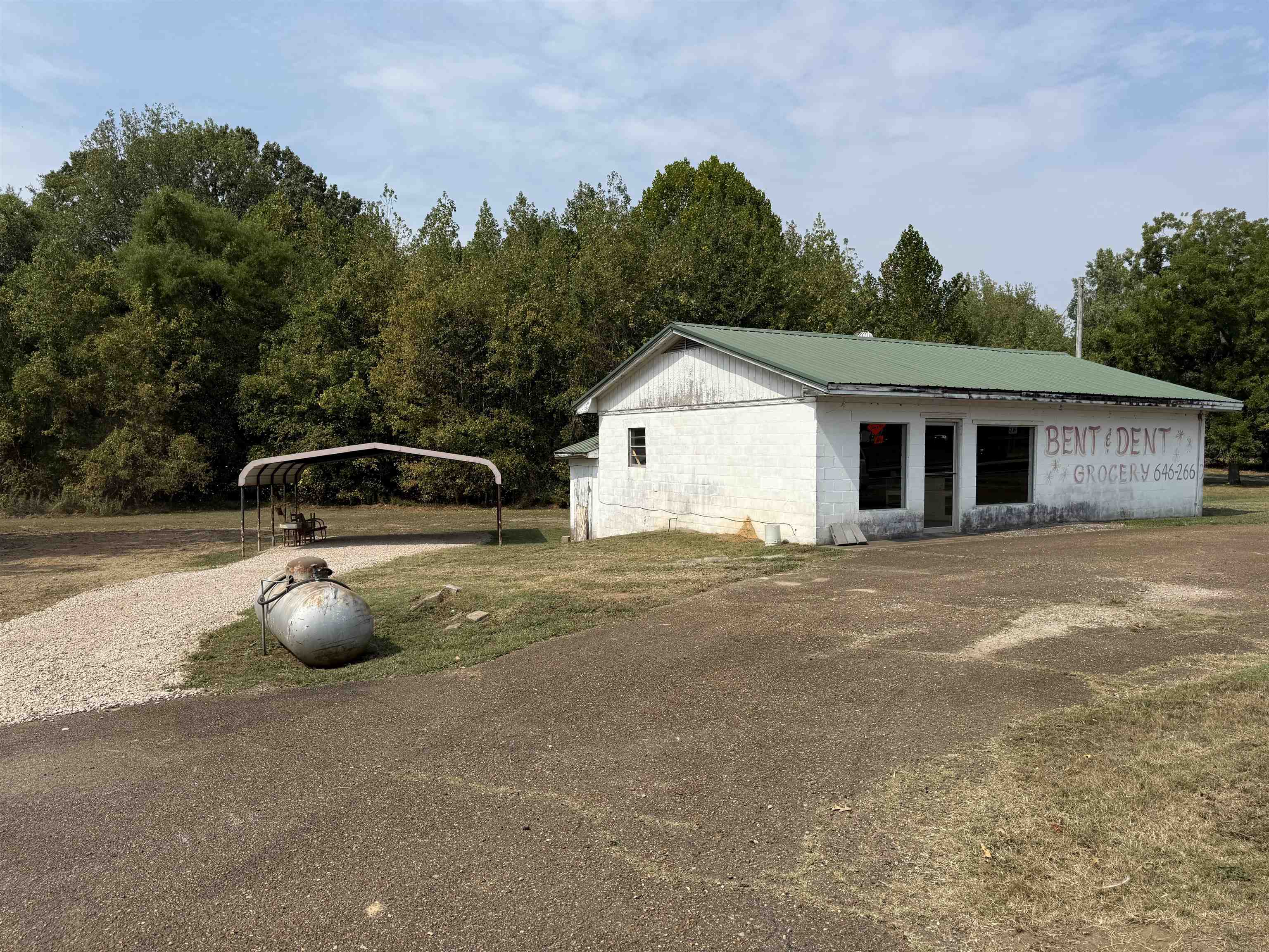 7749 Highway 45 Ramer, TN 38367 - Photo 2 of 6 a front view of a house with parking space