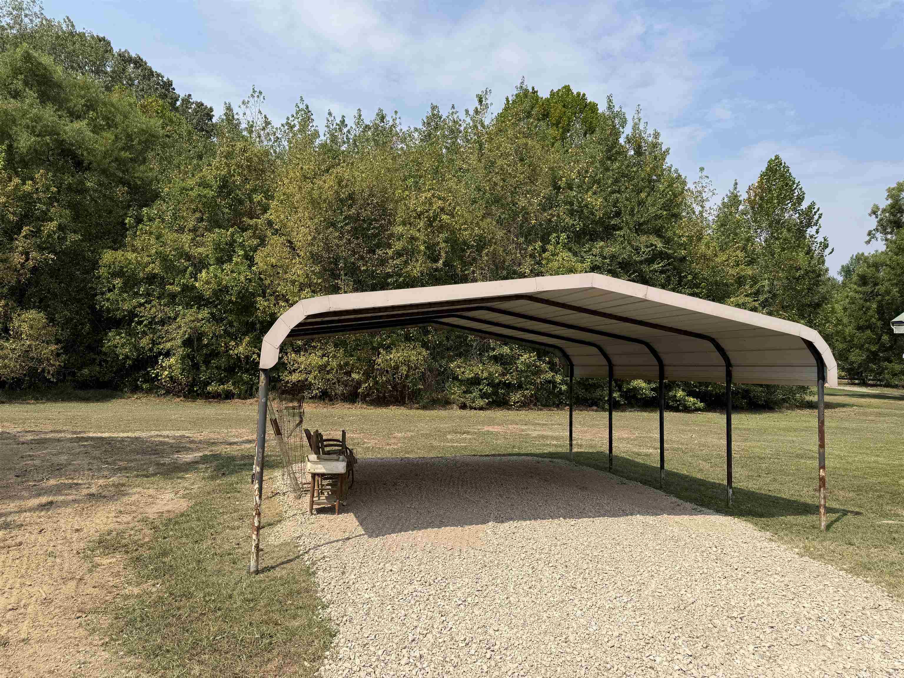 7749 Highway 45 Ramer, TN 38367 - Photo 3 of 6 a view of a yard with a bench in the background