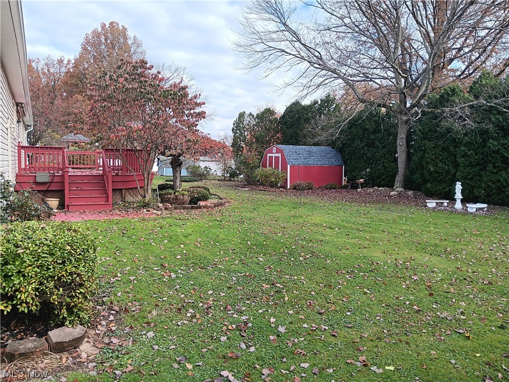 349 Jacobs Road Hubbard, OH 44425 - Photo 4 of 33 View of yard featuring a shed and a wooden deck