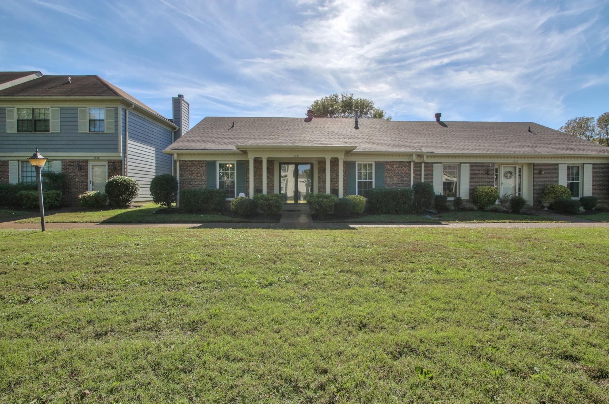 1031 General George Patton Road, Unit 1031 Nashville, TN 37221 - Photo 2 of 14 a front view of a house with a garden