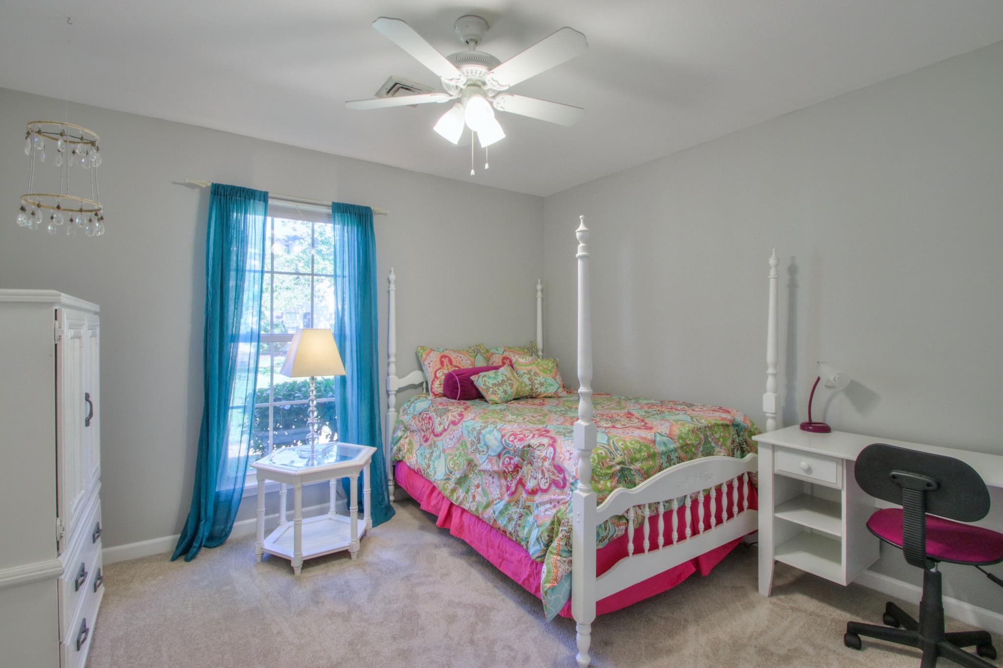 1031 General George Patton Road, Unit 1031 Nashville, TN 37221 - Photo 11 of 14 a bedroom with a bed chair and bed