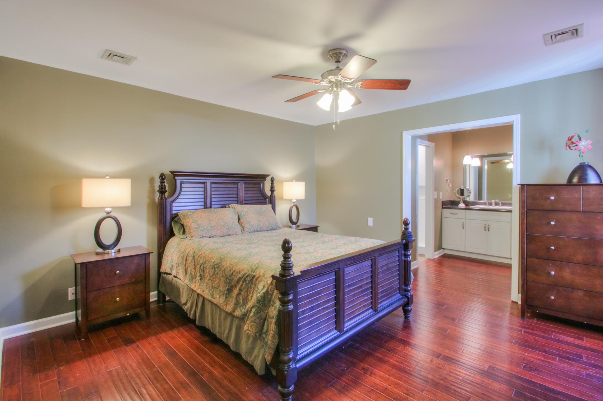 1031 General George Patton Road, Unit 1031 Nashville, TN 37221 - Photo 12 of 14 a bedroom with a bed and wooden floor