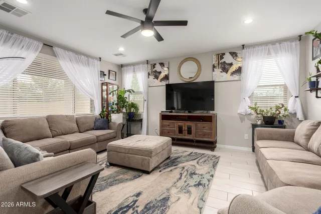 a spacious bedroom with a bed and a couch