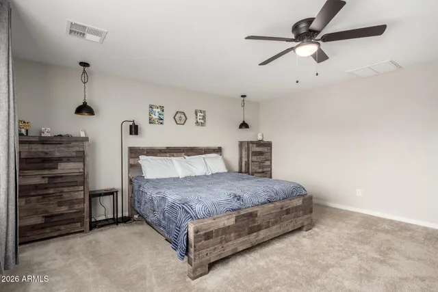 a bedroom with furniture and a bed