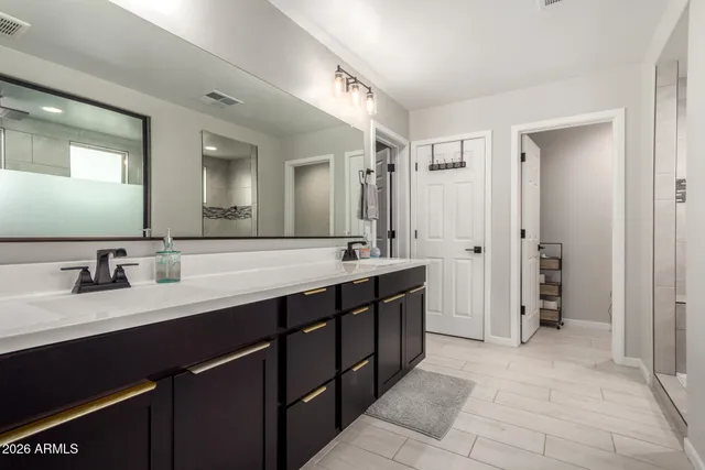 a bedroom with a bed and a desk