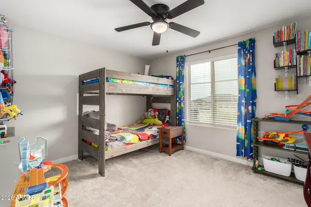 a view of a hallway with paintings on the wall