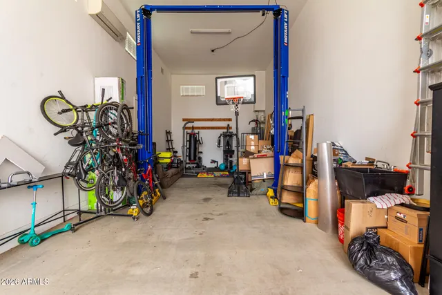 a front view of a house with a yard and potted plants