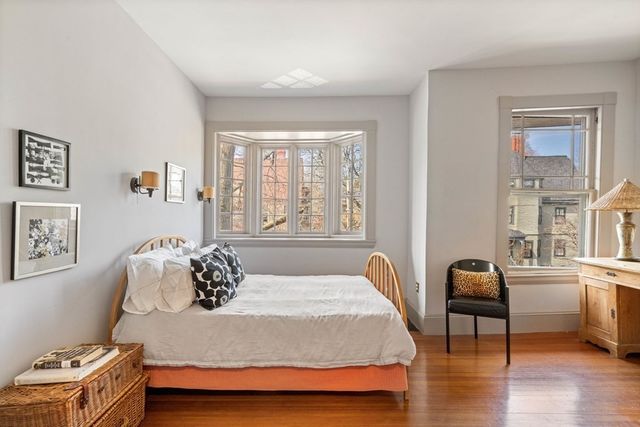 a bathroom with a granite countertop sink mirror bathtub and next