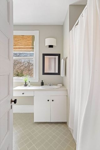 a view of an entryway with table and chair