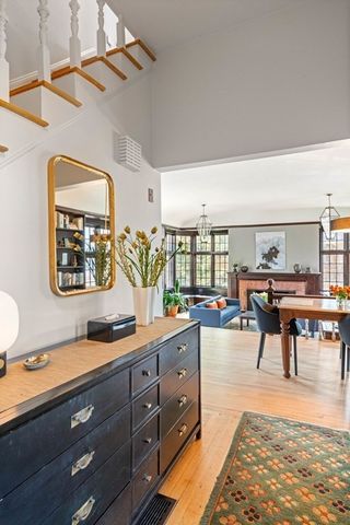 a living room with furniture and painting on the wall