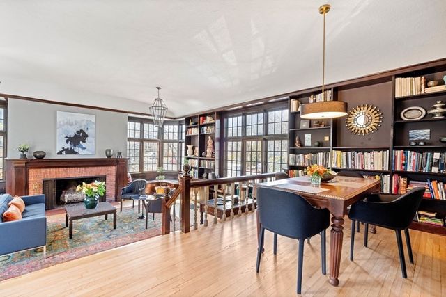 a dining room with furniture and wooden floor