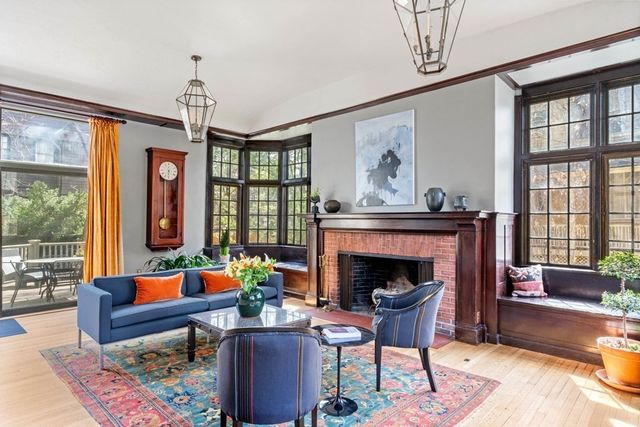 a living room with furniture windows and a fireplace