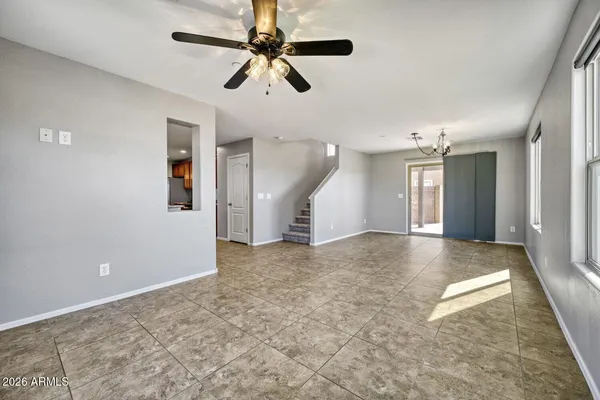 en view interior of a house with a ceiling fan and window