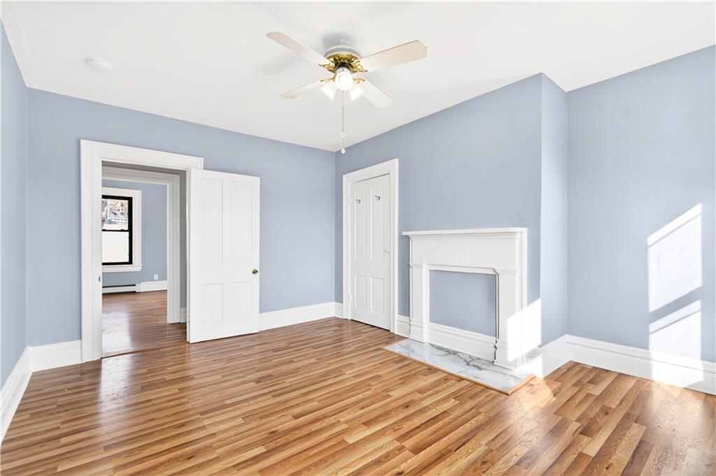 422 West 7th Avenue Tarentum, PA 15084 - Photo 16 of 50 a view of empty room with wooden floor and fireplace