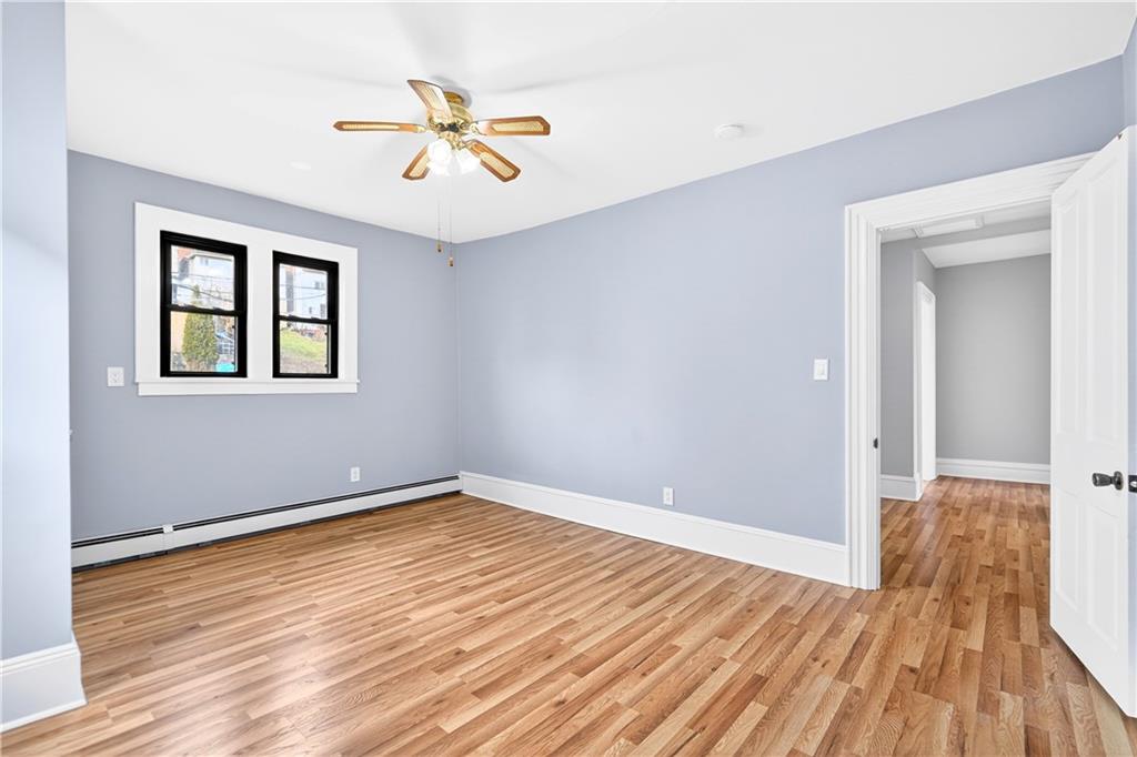 422 West 7th Avenue Tarentum, PA 15084 - Photo 24 of 50 a view of an empty room with wooden floor and a window