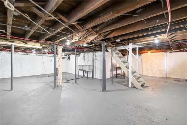 a view of empty room with wooden walls