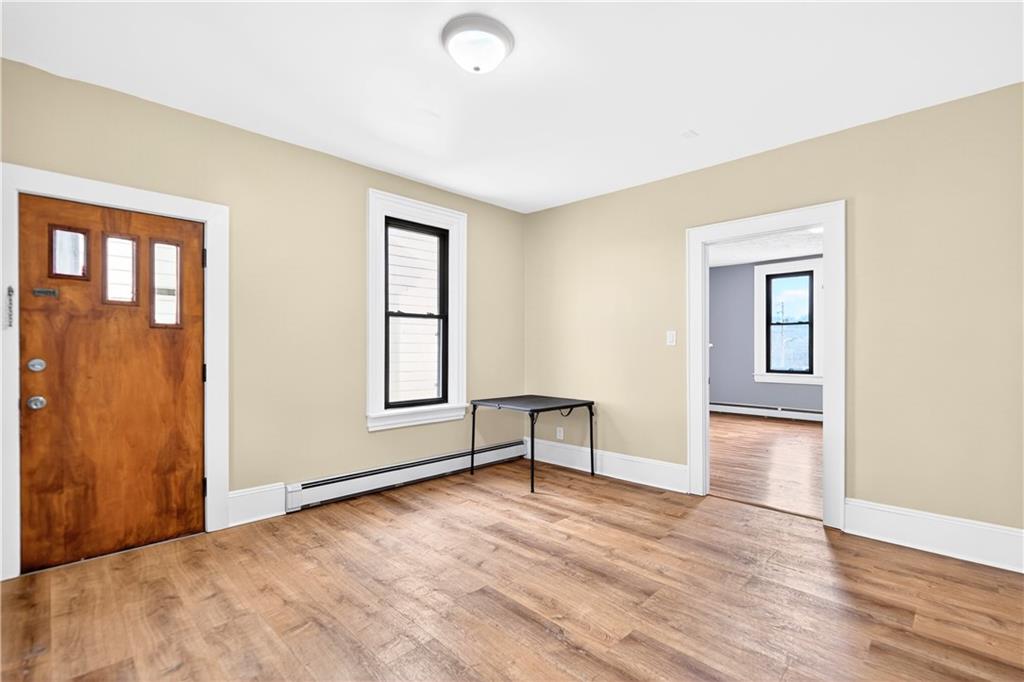 422 West 7th Avenue Tarentum, PA 15084 - Photo 31 of 50 an empty room with wooden floor and windows