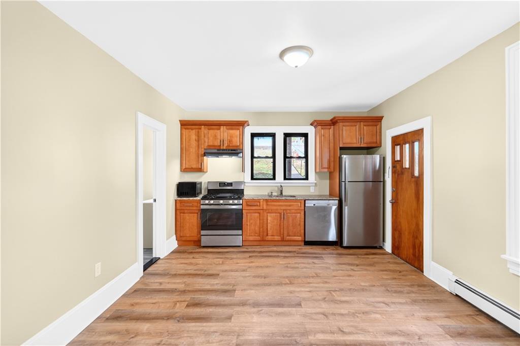 422 West 7th Avenue Tarentum, PA 15084 - Photo 33 of 50 a kitchen with stainless steel appliances granite countertop a refrigerator and a stove top oven