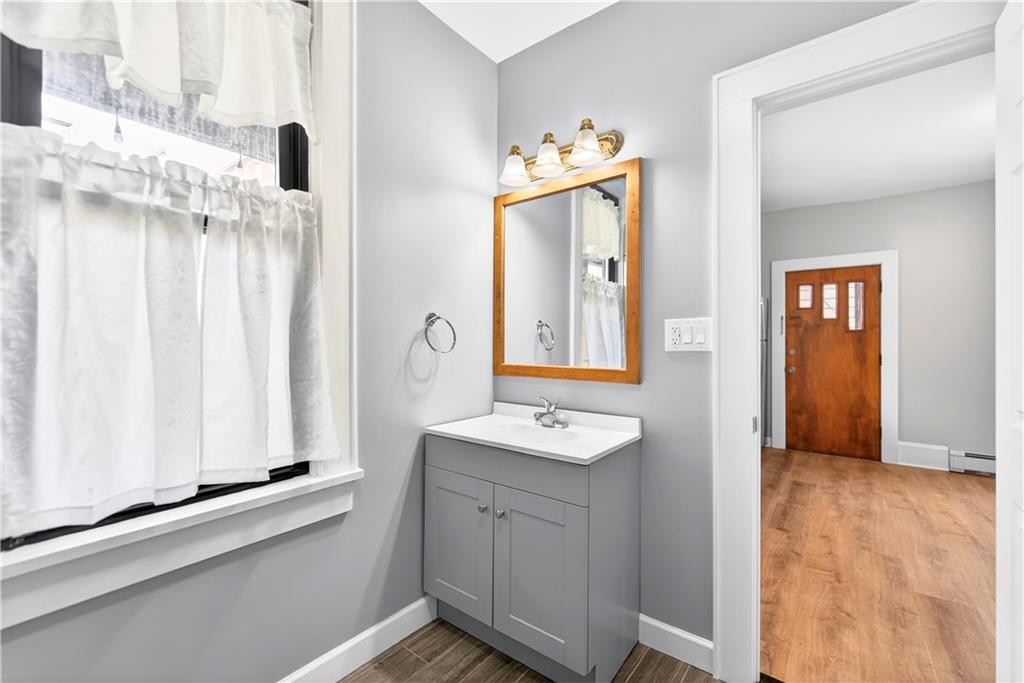 422 West 7th Avenue Tarentum, PA 15084 - Photo 40 of 50 a bathroom with a sink a mirror and a window