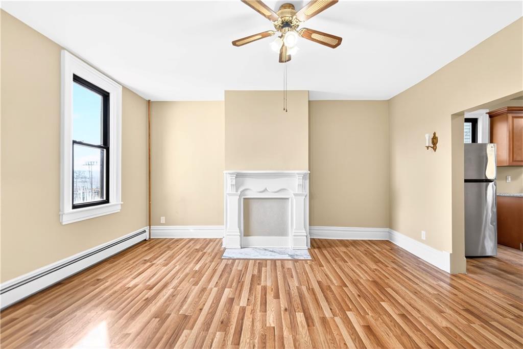 422 West 7th Avenue Tarentum, PA 15084 - Photo 6 of 50 a view of an empty room with wooden floor and a window