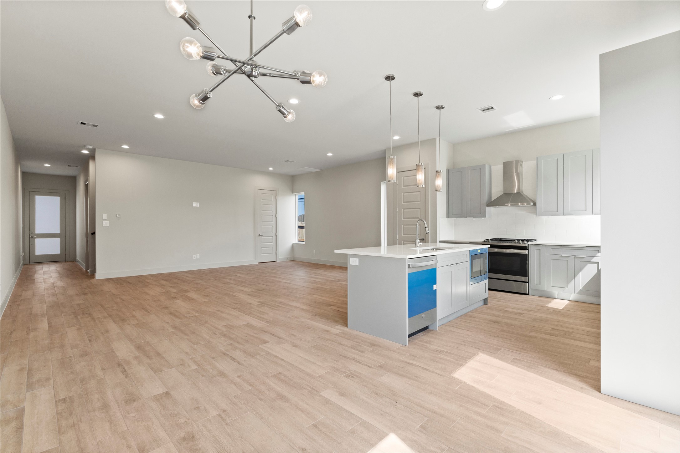 5726 Rucio Lane Houston, TX 77092 - Photo 11 of 30 a large kitchen with stainless steel appliances kitchen island a large counter top and a sink