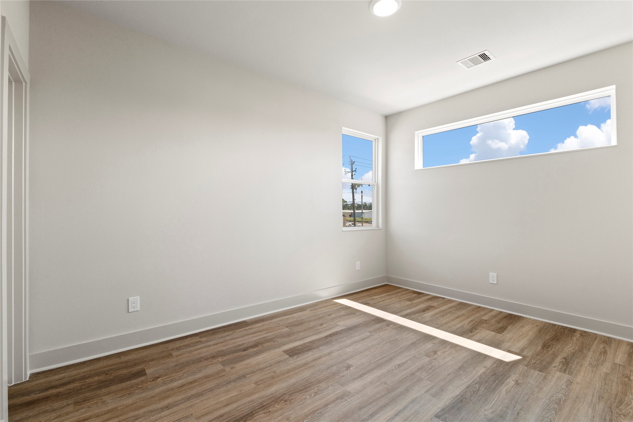5726 Rucio Lane Houston, TX 77092 - Photo 20 of 30 a view of empty room with wooden floor