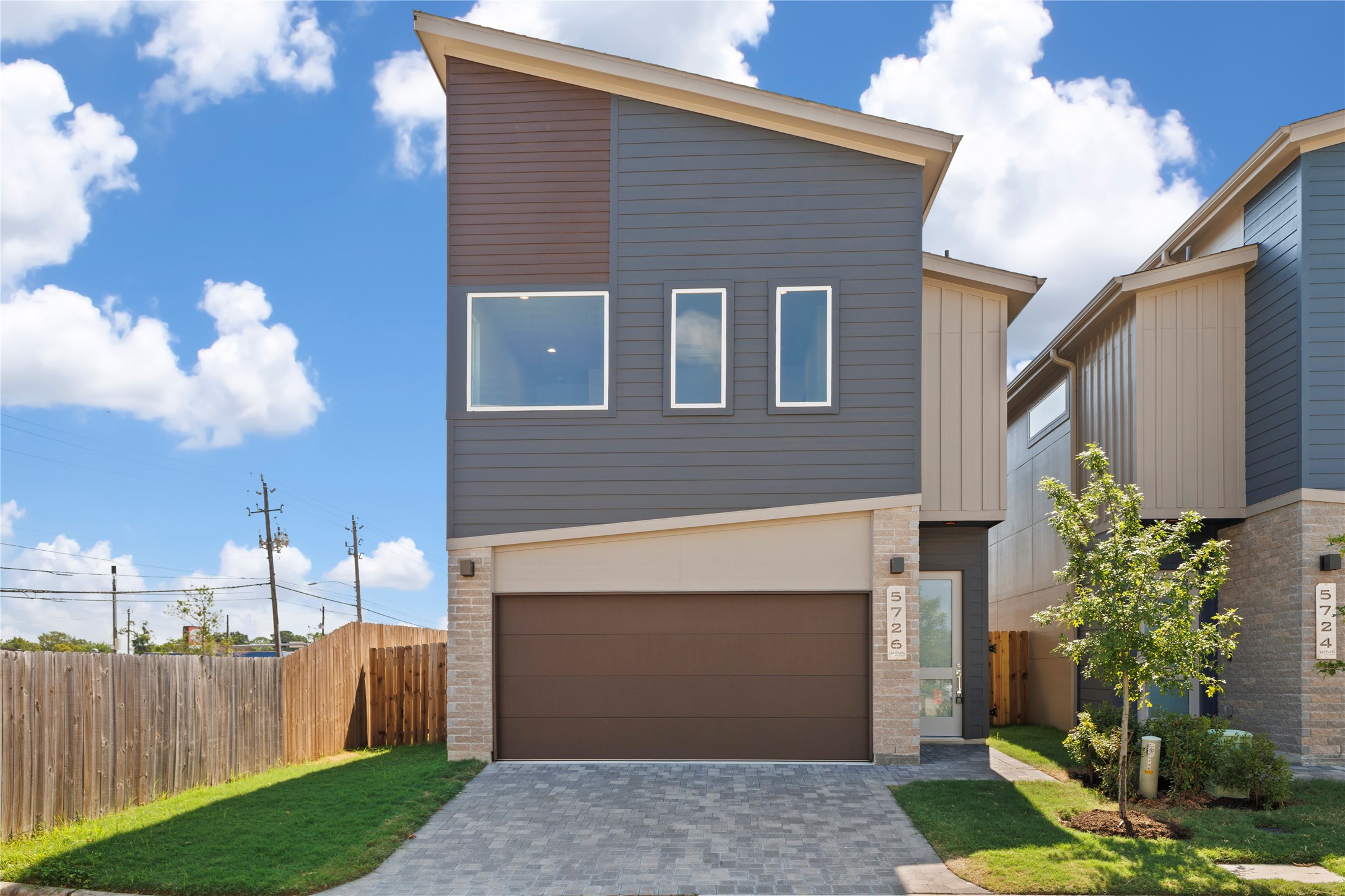 5726 Rucio Lane Houston, TX 77092 - Photo 2 of 30 a front view of a house with a garden and yard