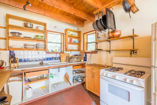 a view of living room with furniture and floor to ceiling windows