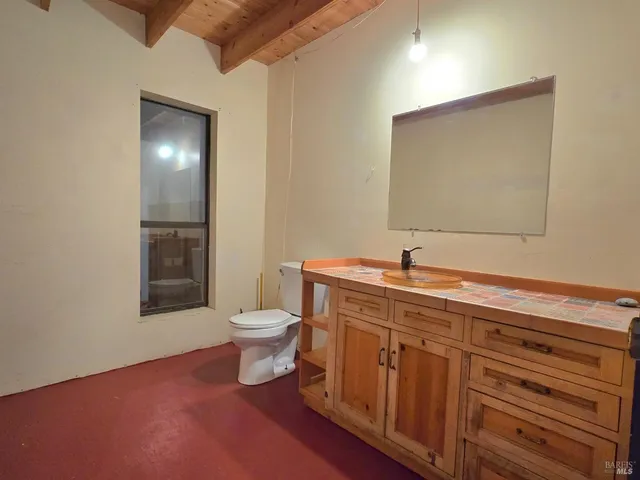 a view of balcony with wooden floor